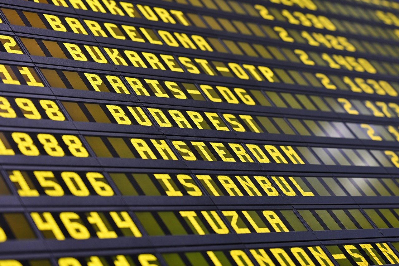 Departures board showing flight information at an airport terminal