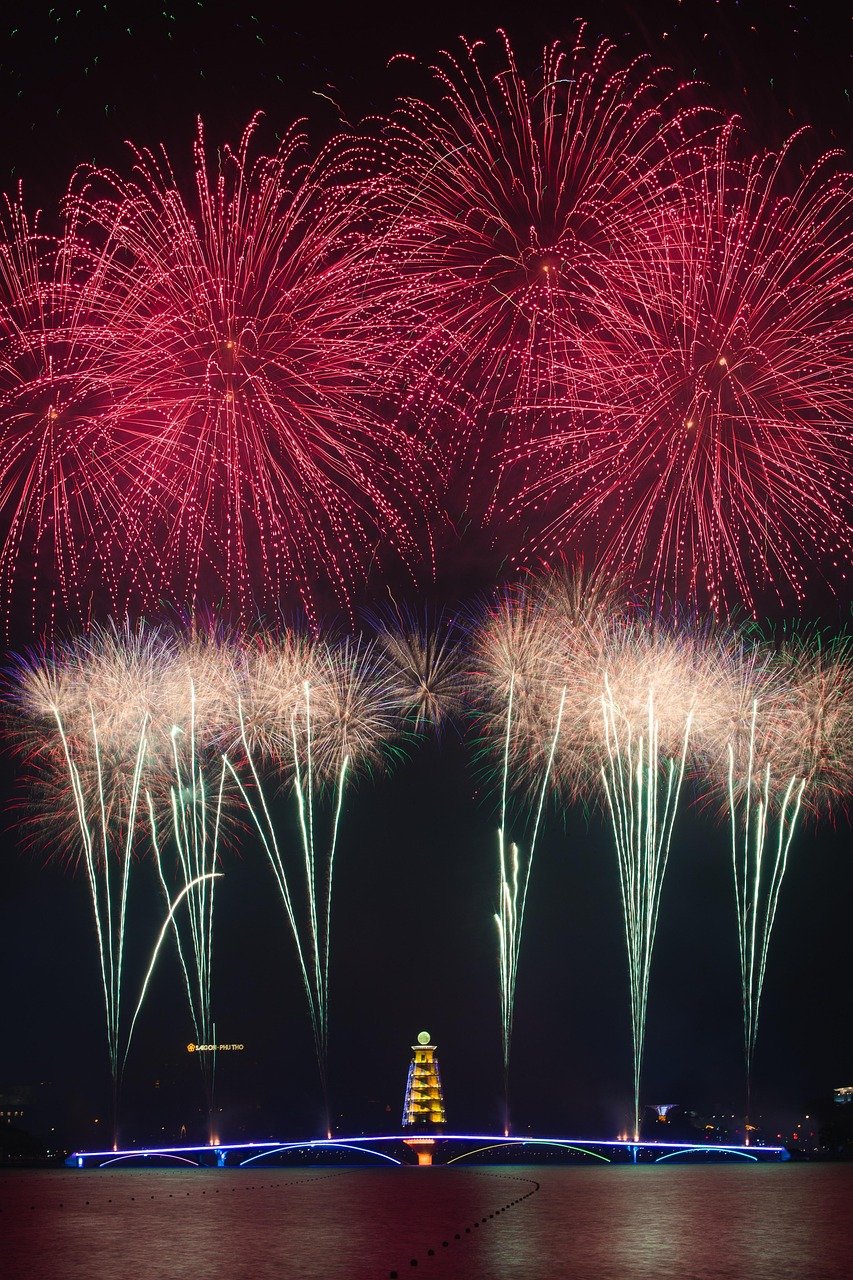 Colourful fireworks display over a city at night
