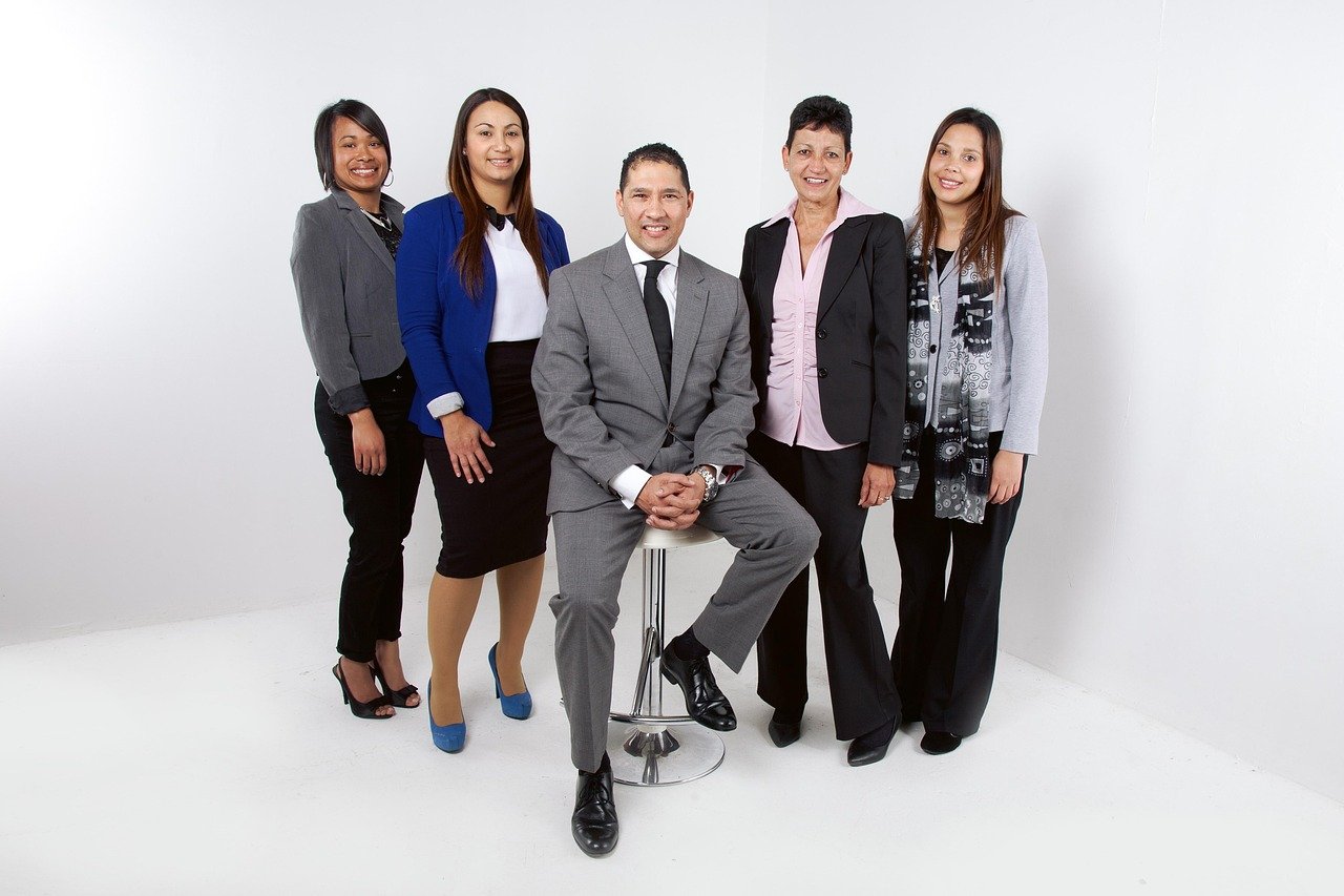 Corporate team working together at a shared office table
