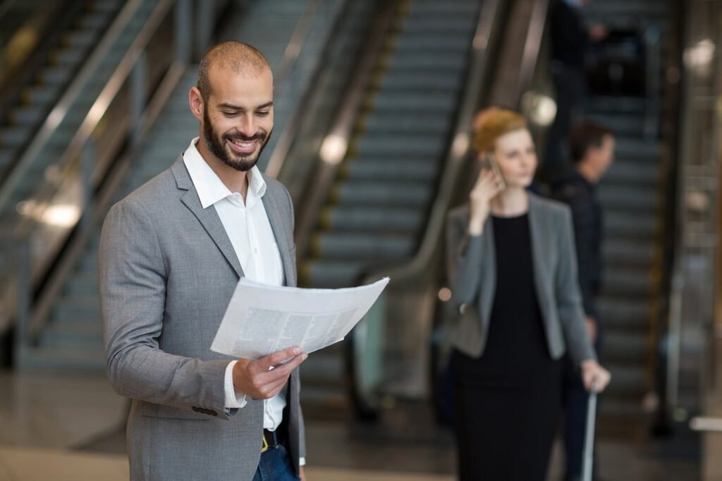 A business traveller arriving at the airport for a corporate trip to Riyadh