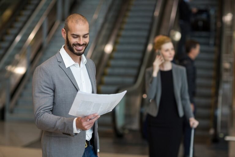 A business traveller arriving at the airport for a corporate trip to Riyadh
