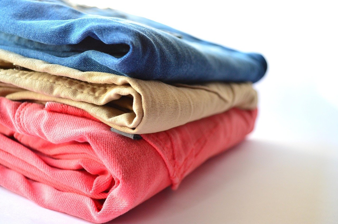 Modest, practical travel clothing packed in a suitcase for a trip to Saudi Arabia