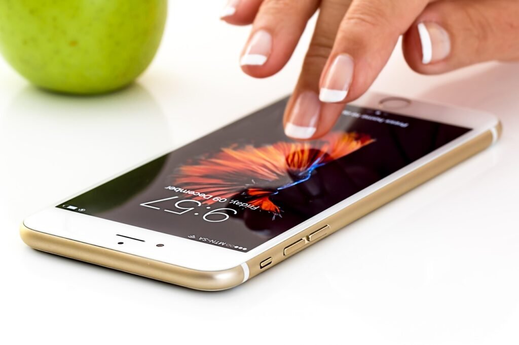 A smartphone being used to compare ride booking options