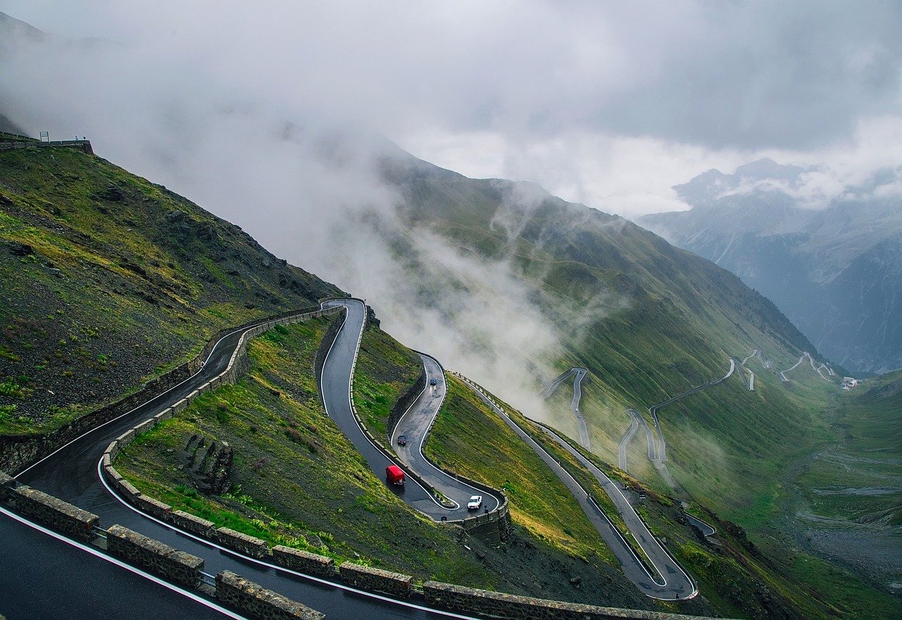 Mountain switchback road climbing toward Taif with valley views