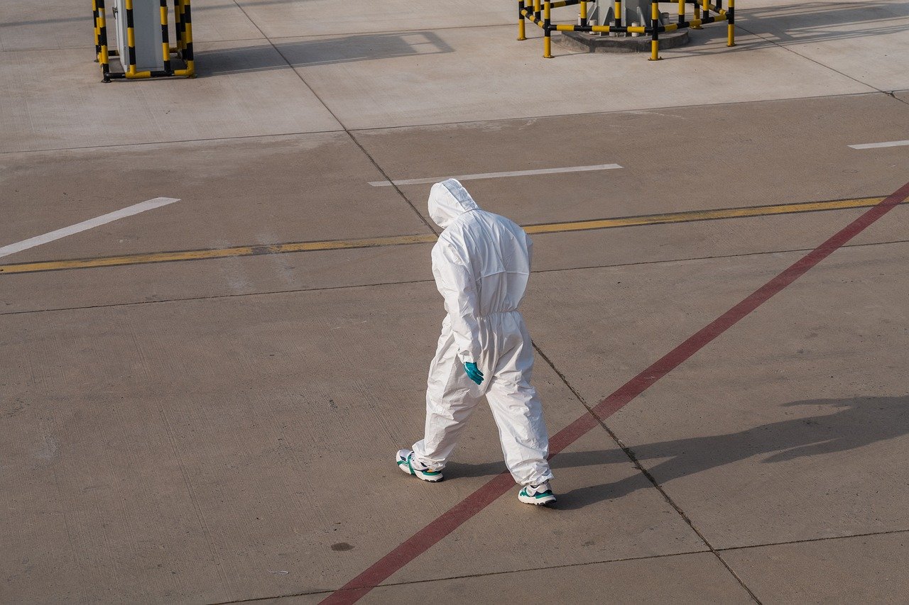 A business traveller arriving at the airport for a corporate trip to Riyadh (wider view)