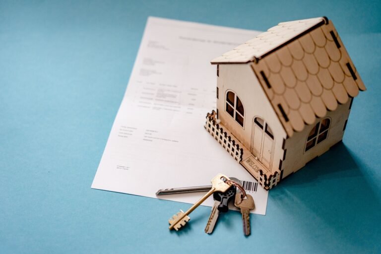 Insurance documents and vehicle keys on a desk